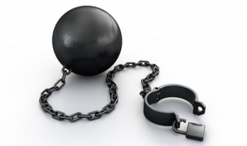 Debt, represented by a ball and chain